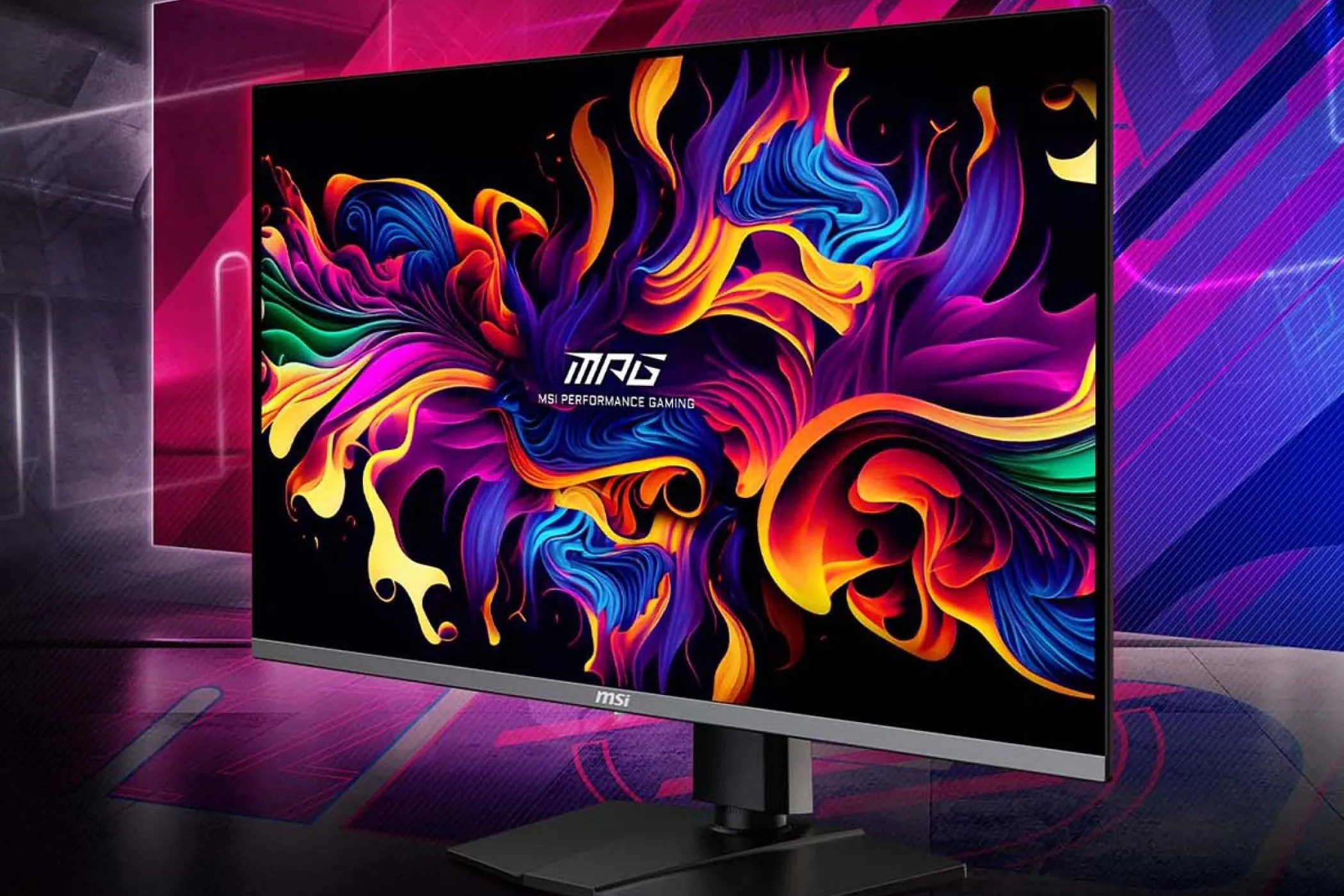 Màn hình chơi game MSI MPG 321URX QD-OLED nổi bật trên bàn làm việc với ánh sáng RGB, minh họa trải nghiệm gaming cao cấp.