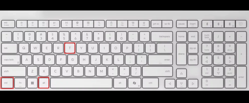 Bàn phím màu trắng với các ô đỏ làm nổi bật các phím Ctrl, Alt và T.