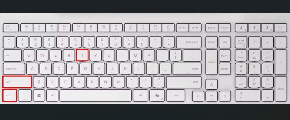 Bàn phím màu trắng với các ô đỏ làm nổi bật các phím Ctrl, Shift và T.