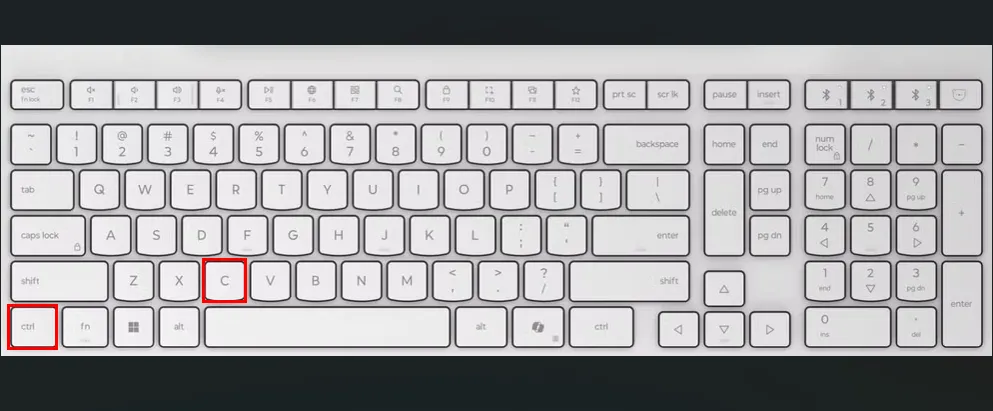 Bàn phím màu trắng với các ô đỏ làm nổi bật các phím Ctrl và C.