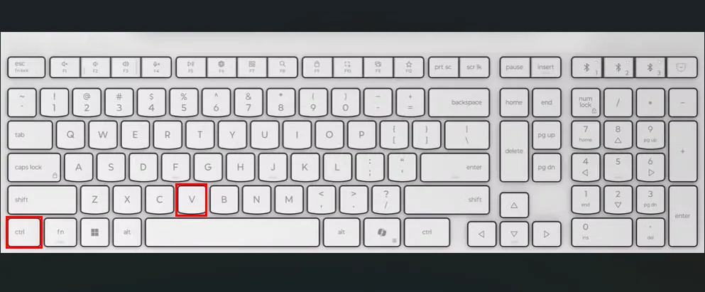Bàn phím màu trắng với các ô đỏ làm nổi bật các phím Ctrl và V.