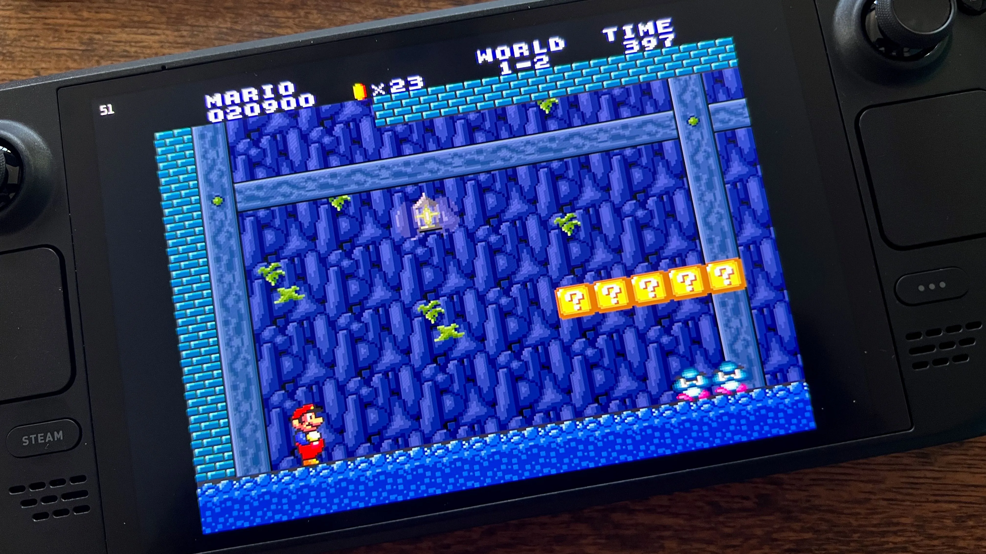 Game Super Mario All-Stars trên Steam Deck, hiển thị màn hình chọn game với đồ họa pixel cổ điển.