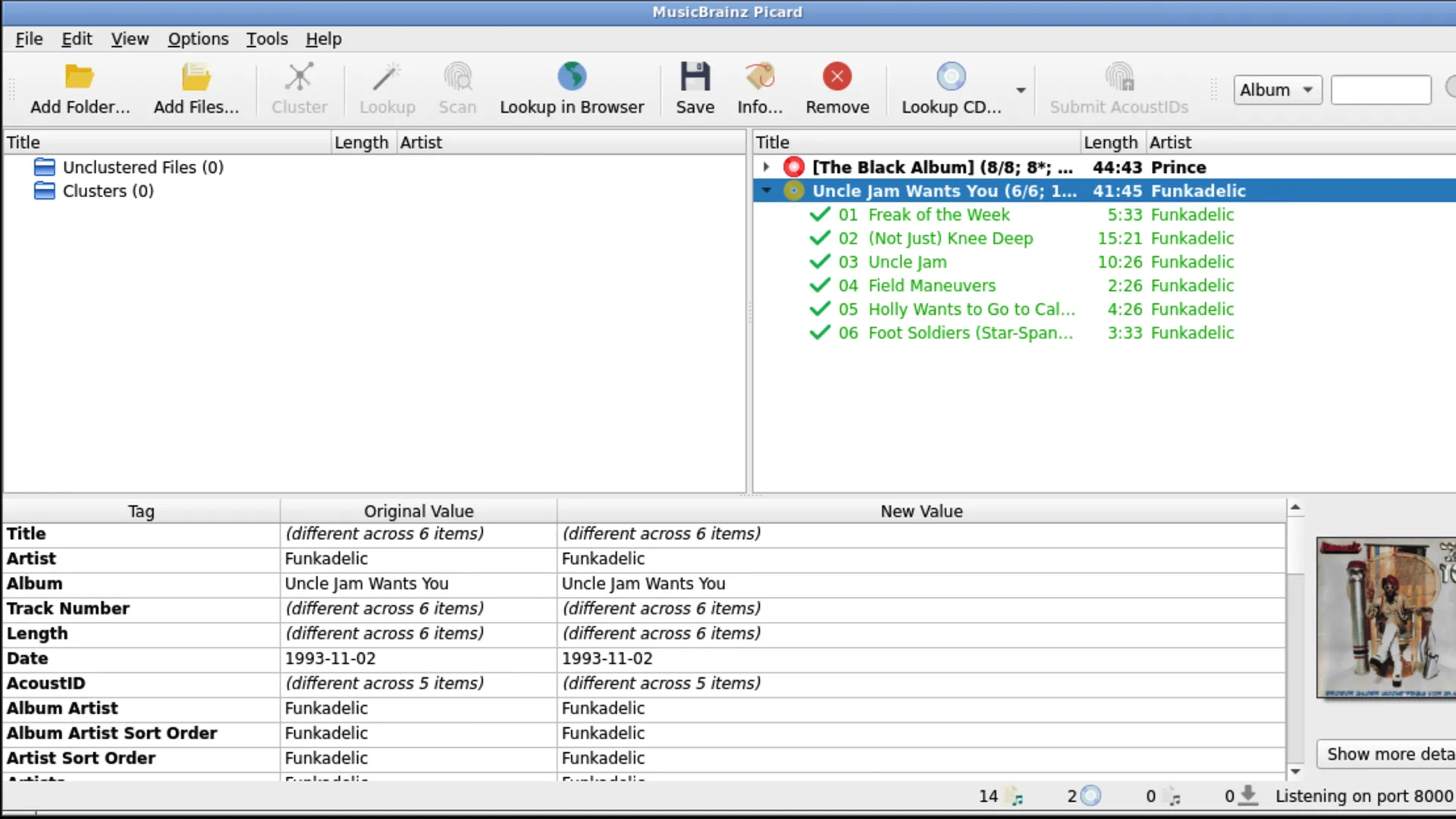 Giao diện MusicBrainz Picard đang xử lý và nhận diện metadata cho hai album nhạc