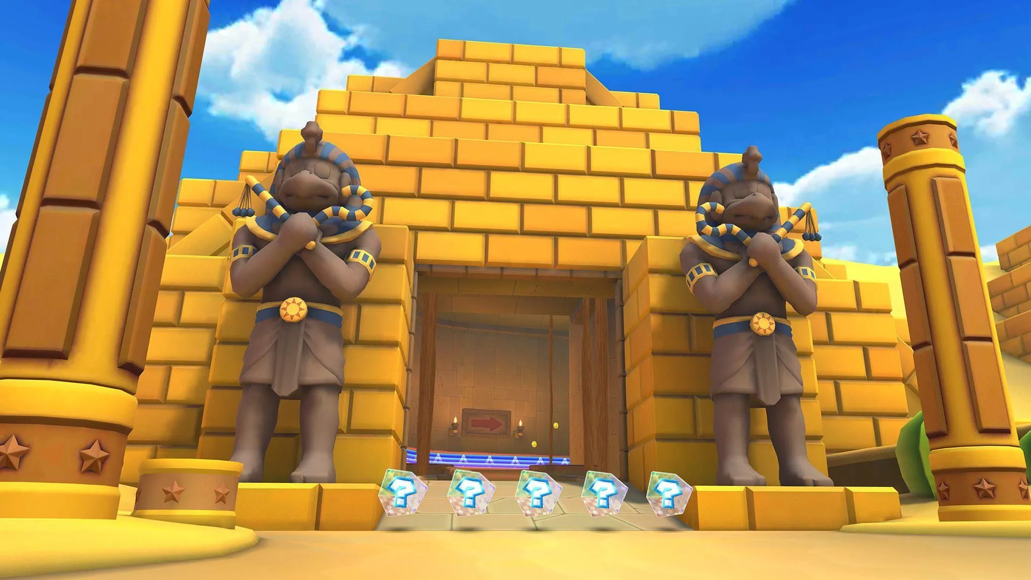Khung cảnh hoang tàn của Dry Dry Ruins với các tượng Pokeys canh gác và địa hình cát bụi trong Mario Kart Tour