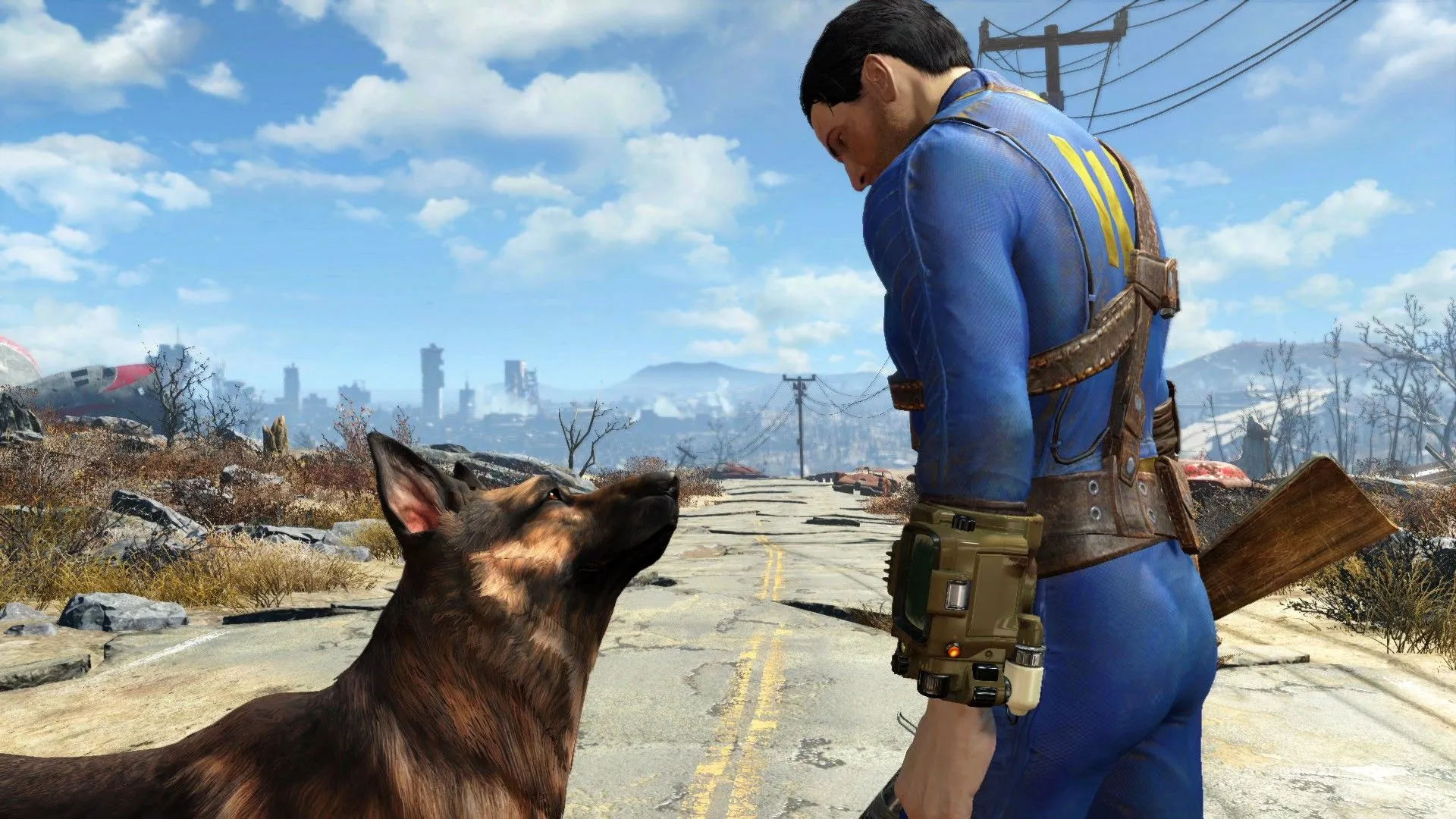 Nhân vật chính Nate nhìn xuống Dogmeat trên con đường hoang tàn trong Fallout 4, tựa game từng gặp rắc rối với chính sách mod của Sony trên PlayStation.