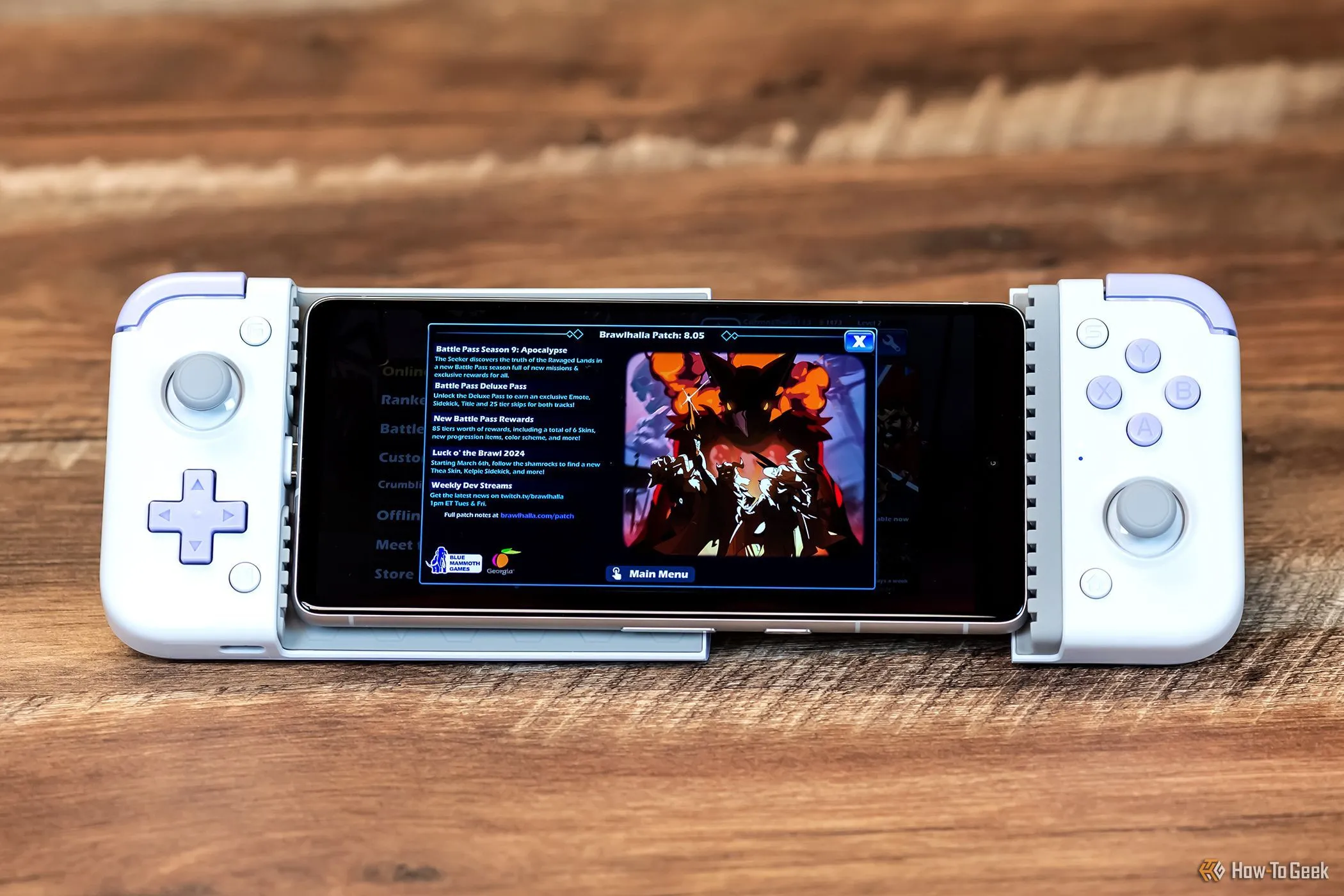 Tay cầm chơi game GameSir X2s Type-C được kết nối với điện thoại thông minh, minh họa việc chơi Brawhalla trên di động, nâng cao trải nghiệm game trên smartphone.