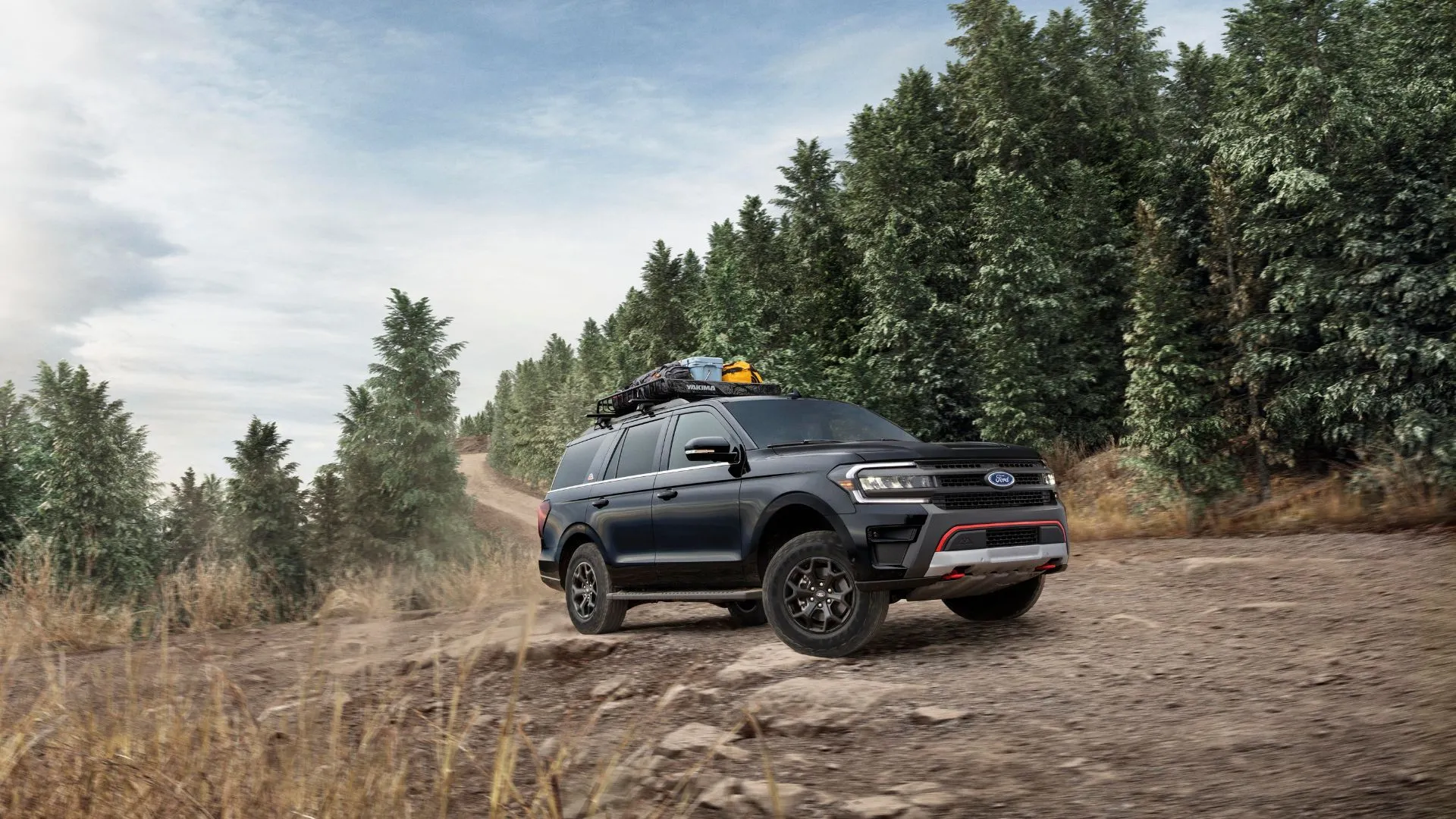 Mẫu SUV Ford Expedition Timberline 2024 màu xanh rêu đang di chuyển trên địa hình gồ ghề